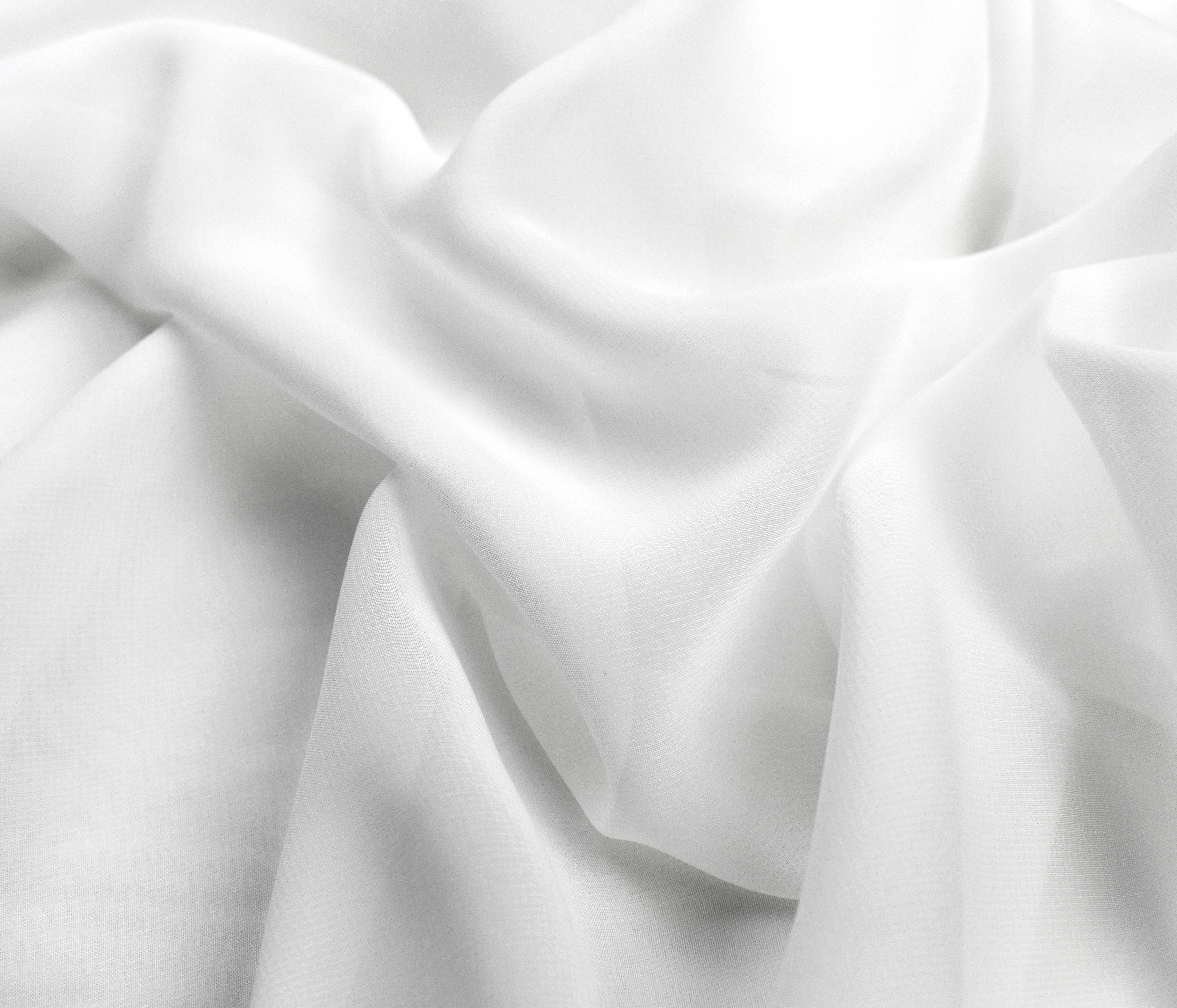 Textured white woven fabric close-up